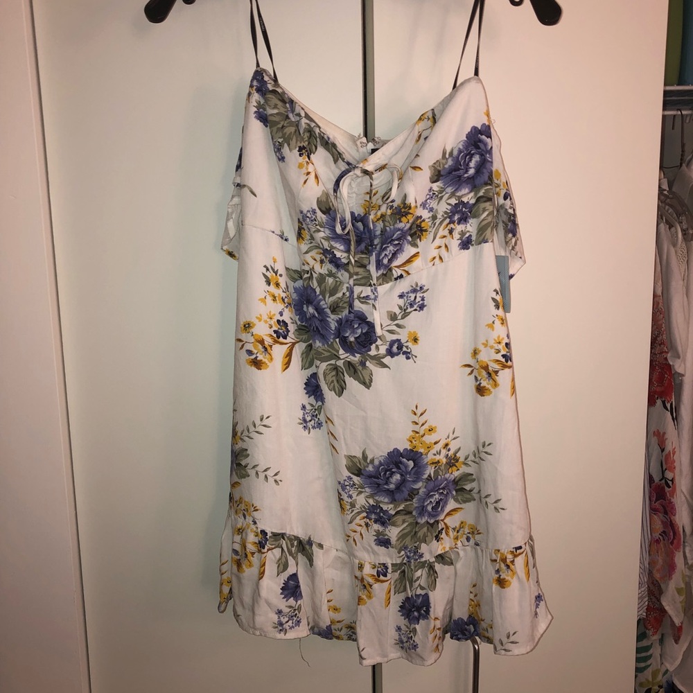 White dress with flowers on it